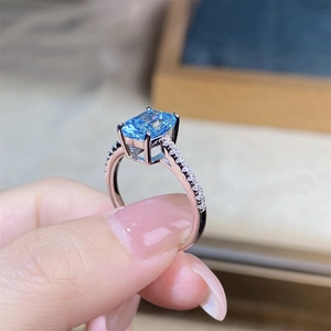 Macro shot of S925 silver ring featuring radiant cut aquamarine with side diamonds