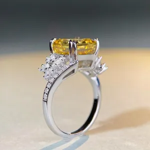 Luxurious S925 silver ring featuring a radiant cut yellow gem and side diamonds