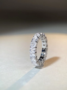 Close-up of S925 sterling silver eternity ring with full square-cut step diamonds