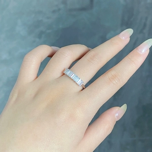 Detailed close-up of S925 sterling silver ring with emerald-cut cubic zirconia stones