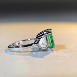 S925 sterling silver ring featuring a 5-carat emerald-cut green stone with side stones