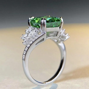 Elegant S925 silver ring with emerald cut green gemstone and white zircon accents