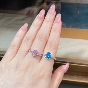 Macro shot of S925 silver rings with radiant cut pink and blue aquamarine stones