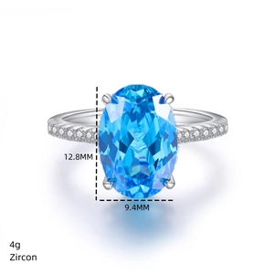 Detailed view of oval blue zircon ring showing 12.8mm x 9.4mm stone size and 4g weight