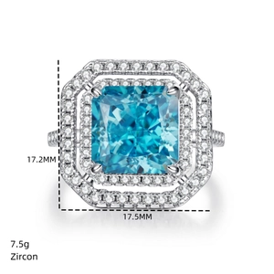 Macro detail of S925 silver ring featuring radiant cut blue zircon and double halo stones