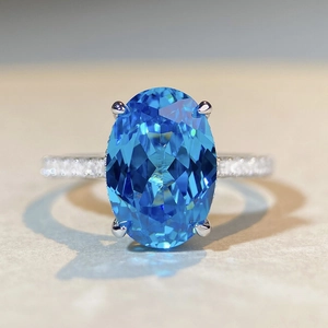 Elegant S925 sterling silver ring with large oval blue gemstone and zircon pave band