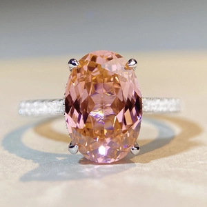 Luxurious S925 silver ring featuring a 6-carat oval pink sapphire and micro-pave diamonds