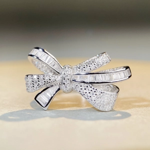 Elegant S925 silver bow ring with shimmering full pavé zircon and baguette crystals