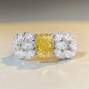 Radiant cut yellow diamond S925 silver feather ring with marquise cluster accent