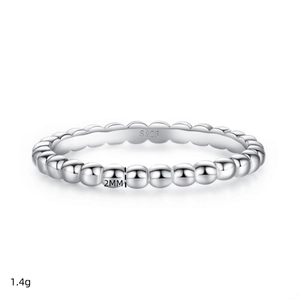 Detailed close-up of 2mm S925 sterling silver bubble ring with hallmark engraving