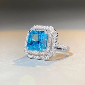 Luxurious S925 silver ring with radiant cut blue stone and double diamond halo