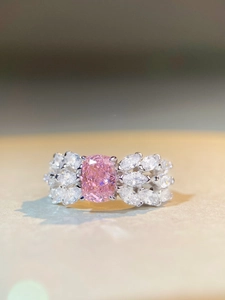 Macro shot of S925 silver ring featuring radiant pink gemstone and marquise accents