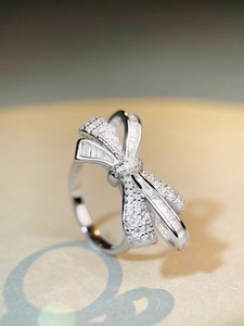 Close-up of bow ring with baguette-cut and pavé cubic zirconia in S925 silver