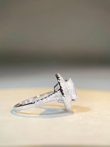Macro side view of S925 sterling silver ring with radiant halo cut rectangle gemstone
