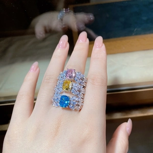 Macro view of three S925 sterling silver rings with colorful cushion-cut gemstones