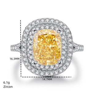 Macro shot of 6.1g cushion-cut yellow zircon ring with silver setting and size details