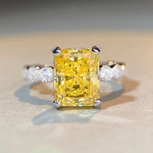 Radiant cut yellow gemstone ring in 925 sterling silver with four-prong setting design