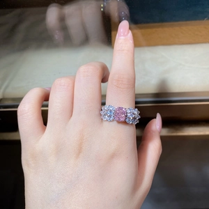 Close-up of pink radiant cut crystal ring on finger with S925 sterling silver band