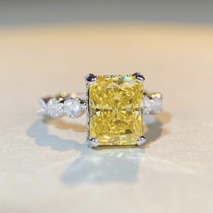 Close-up of radiant cut yellow gemstone ring with S925 silver four-prong setting