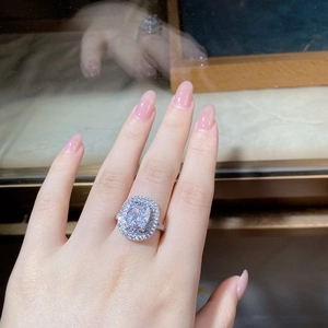 Macro shot of S925 sterling silver ring with radiant cut gemstone and double halo diamonds