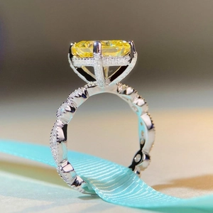 Luxurious S925 silver ring with princess cut yellow diamond and twisted pavé band