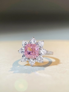 Close-up of cushion-cut pink gemstone ring with pear-shaped halo in S925 silver