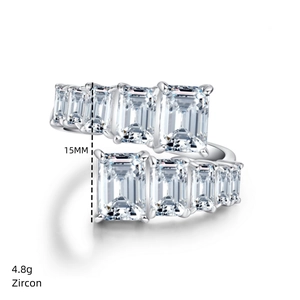 Detail of 925 sterling silver ring featuring emerald cut zircons and 15mm width band
