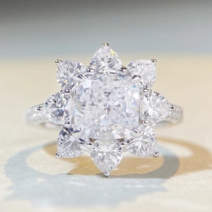 Sparkling S925 sterling silver ring featuring flower shaped square and pear cut stones