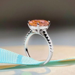 Exquisite S925 silver ring featuring a 6ct oval pink stone and brilliant halo diamonds