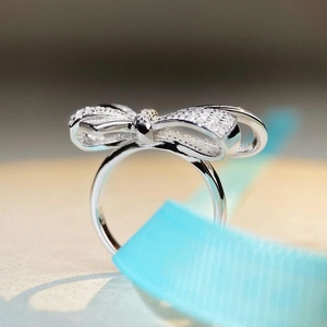 Elegant S925 silver bow ring with full pavé cubic zirconia diamonds in white gold finish