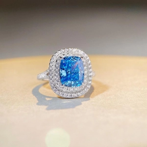 Halo cushion cut blue sapphire ring in 925 silver with double pavé diamond borders
