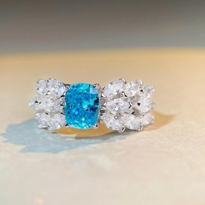Elegant S925 silver ring with cushion-cut blue gemstone and marquise diamond accents