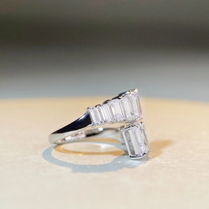 Detail of 925 sterling silver adjustable ring with rectangular step-cut gemstones