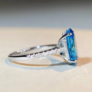 S925 sterling silver ring with oval cut aquamarine blue gemstone and pavé diamonds