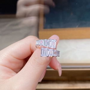 Macro shot of 925 silver wrap ring featuring emerald-cut cubic zirconia in a gradient layout
