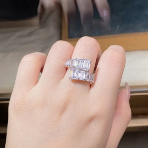 Macro detail of adjustable S925 sterling silver ring featuring double row emerald cut cubic zirconia