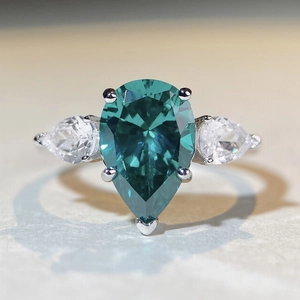 Pear cut teal gemstone ring in S925 sterling silver with sparkling side zircon stones