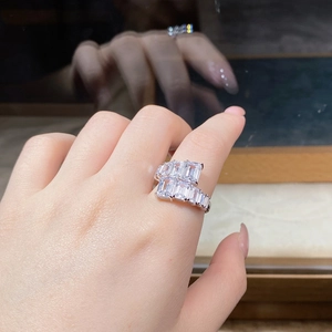Close-up of a 925 sterling silver ring with multi-layered emerald cut zircon stones