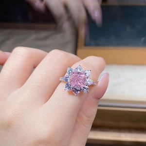 Detailed view of S925 silver sunflower ring with pink square gem and pear halo
