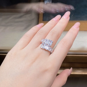 Close-up of dual-row baguette-cut zircon stones on a silver adjustable open ring