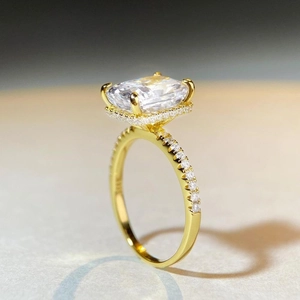 Luxurious 18K gold S925 silver ring featuring a large princess cut clear stone halo setting
