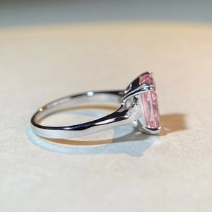 S925 sterling silver ring with radiant cut pink diamond and white trapezoid side stones