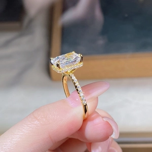 Macro shot of 18K gold S925 sterling silver ring with princess cut gemstone and pavé diamonds