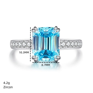 Macro shot showing 10.3x8.7mm rectangular blue zircon on silver ring with side stones