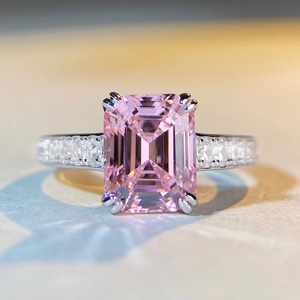 Luxurious S925 silver ring with emerald-cut pink diamond and sparkling side stones