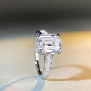 Luxurious S925 silver ring featuring emerald cut center stone and pavé diamond band
