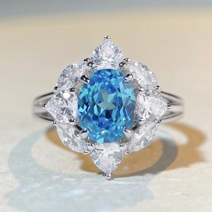S925 sterling silver ring featuring an oval aquamarine center with pear-cut zircon petals