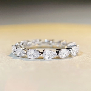 Elegant S925 sterling silver eternity ring featuring a row of pear-cut sparkling diamonds