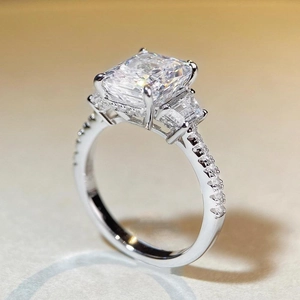 Macro side view of S925 silver radiant cut radiant ring with side trapezoid diamonds