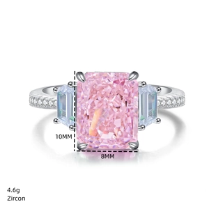 Detail shot of a 10x8mm radiant cut pink zircon ring with trapezoid side stones